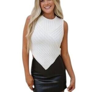 Cream knit top with a flattering V-neck and side slits